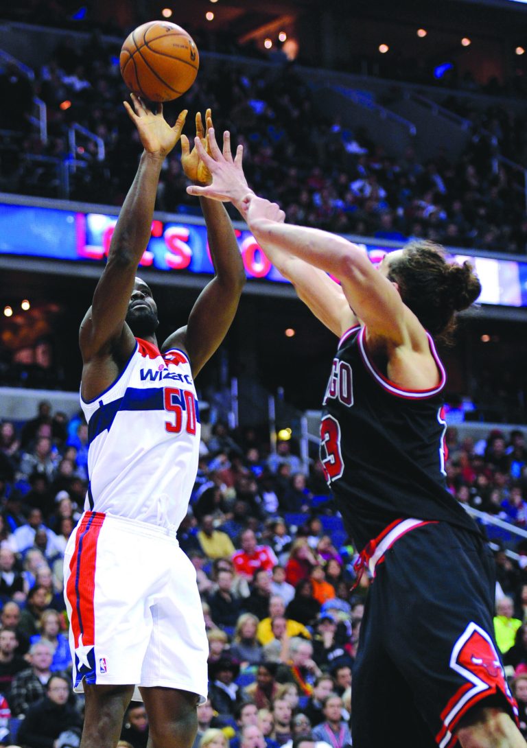Nick Wass/AP
Center Emeka Okafor finished with 15 points and 16 rebounds as the Wizards beat the Bulls on Saturday at Verizon Center.