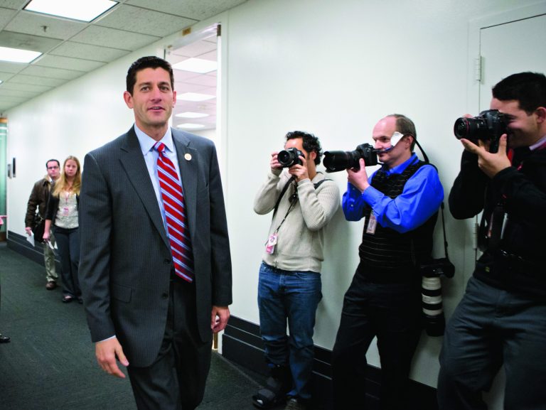 FILE - This Nov. 28, 2012 file photo shows House Budget Committee Chairman Rep. Paul Ryan, R-Wis. walking on Capitol Hill in Washington. House Republicans say they may seek a short-term extension of the government's debt limit in the next few weeks, a move that would avoid an immediate default by the Treasury. Ryan provided no details on the duration of any extension or conditions that might be attached as he appeared at a news conference during a break at a three-day retreat of the rank and file in historic Williamsburg, Va. (AP Photo/J. Scott Applewhite, File)