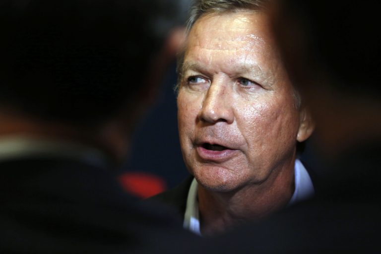 Republican presidential candidate Ohio Gov. John Kasich speaks to reporters Tuesday, Sept. 8, 2015, in Concord, N.H. (AP Photo/Jim Cole)