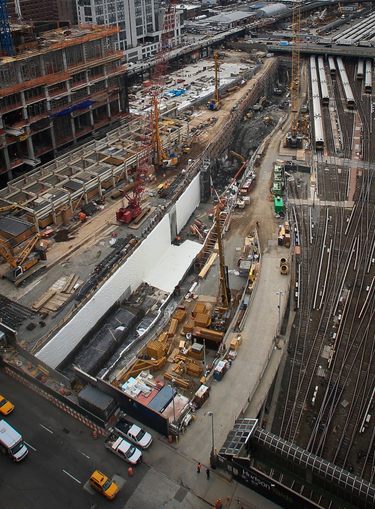 This photo made Thursday April 17, 2014, shows ongoing construction of a rail tunnel, center,  at the Hudson Yards redevelopment site on Manhattan's west side in New York.  Amtrak is constructing an 800-foot-long concrete box inside the project to preserve space for a tunnel from Newark to New York City that would allow it to double rail capacity across the Hudson River. (AP Photo/Bebeto Matthews)