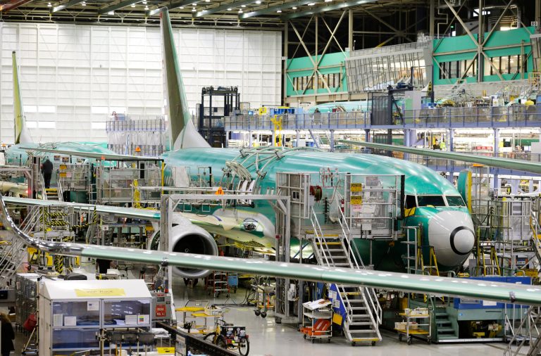 Boeing 737-800 airplanes are on the assembly line Tuesday, Dec. 16, 2014, at Boeing's 737 assembly facility in Renton, Wash. (AP Photo/Ted S. Warren)