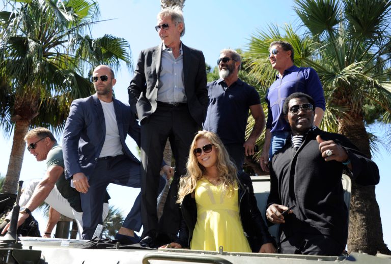 From left, Dolph Lundgren, Jason Statham, Harrison Ford, Mel Gibson, Sylvester Stallone, Wesley Snipes and Ronda Rousey during a photo call for The Expendables 3 at the 67th international film festival, Cannes, southern France, Sunday, May 18, 2014. (Photo by Arthur Mola/Invision/AP)