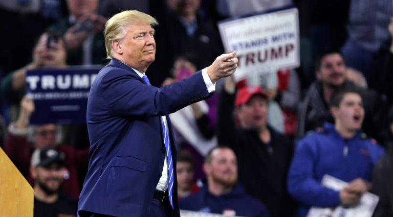Within ten minutes of taking the stage at an arena in Lowell, Mass., Donald Trump faced three separate interruptions. (AP Photo/Charles Krupa)