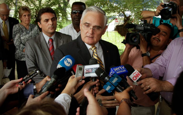 Panama Canal Administrator Jorge Quijano talks to the press during the recess of a meeting with a Spanish-led consortium working on expanding the Panama Canal, and the Authority's insurance company in Panama City, Tuesday, Jan. 21, 2014. The meeting was called to resolve cost overruns on the canal's expansion project. (AP Photo/Arnulfo Franco)