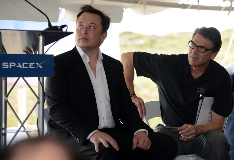 SpaceX founder and CEO Elon Musk, left, and Texas Gov. Rick Perry, look on during the Space X ground breaking ceremony at the Boca Chica Launch Site on the southern tip of Texas, Monday, Sept. 22, 2014. The commercial rocket launches that could begin as early as 2016 in the southernmost tip of Texas will be a critical step toward one day establishing a human presence on Mars, SpaceX founder and CEO Elon Musk said Monday. (AP Photo/The Brownsville Herald, Yvette Vela)