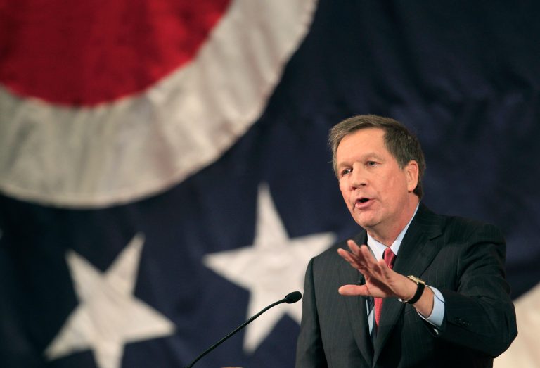   FILE - In this Feb. 7, 2012, file photo, Ohio Gov. John Kasich delivers his State of the State address at Wells Academy/Steubenville High School in Steubenville, Ohio. The nation's unemployment rate of 8.2 percent may sink President Barack Obama's re-election bid, but one detail brightens his hopes. About 10 battleground states will decide the election, and seven of them have employment levels that beat the U.S. average. In Ohio, the quintessential toss-up state and practically a must-win for Mitt Romney, Republican Gov. Kasich tries to finesse the political dilemma by saying jobs have increased despite Obama's policies.(AP Photo/Tony Dejak, File)  