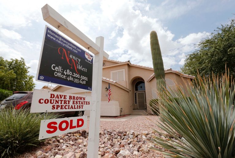 FILE - In this Thursday, Aug. 22, 2013, file photo, an existing home is listed as sold, in Gilbert, Ariz. Freddie Mac, on Thursday, Dec. 12,  2013, reports on mortgage rates for the week. (AP Photo/Matt York, File)