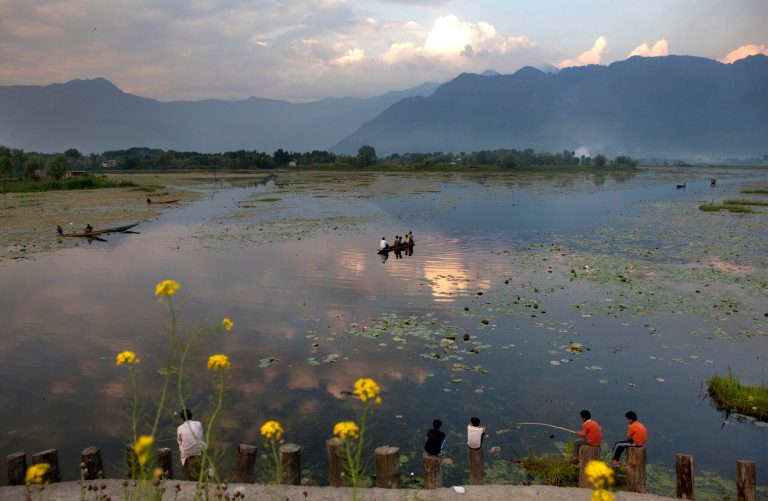   In this photo taken on Wednesday, May 13, 2012, Kashmiri Muslims fish on the shore of Nageen Lake on the outskirts of Srinagar, India. Traditional measures of economic progress like GDP are being criticized as inadequate for ignoring such downsides as pollution or diminishing resources from fresh water to fossil fuels. There is increased urgency to arguments for a more balanced and accurate reckoning of the costs, particularly as fast-developing nations such as India and China jostle with rich nations for access to those limited resources and insist on their right to pollute on a path toward economic development. (AP Photo/ Dar Yasin)  