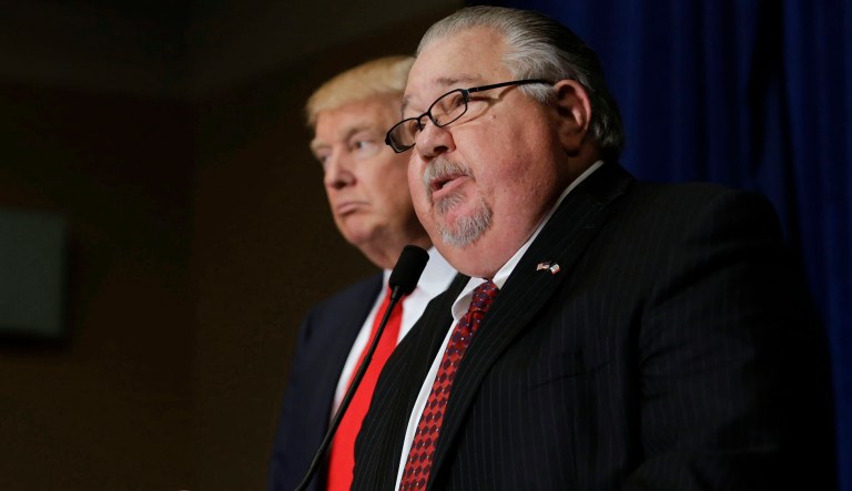 Sam Clovis, newly appointed national co-chairman of the Trump campaign, speaks during a news conference with Donald Trump, president and chief executive of Trump Organization Inc. and 2016 Republican presidential candidate, left, ahead of a rally at Grand River Center in Dubuque, Iowa, U.S., on Tuesday, Aug. 25, 2015. President Barack Obama's top business ambassador dismissed Trump's call for a wall along the Mexico border, saying the U.S. is focused instead on expanding business with one of its biggest trade partners.