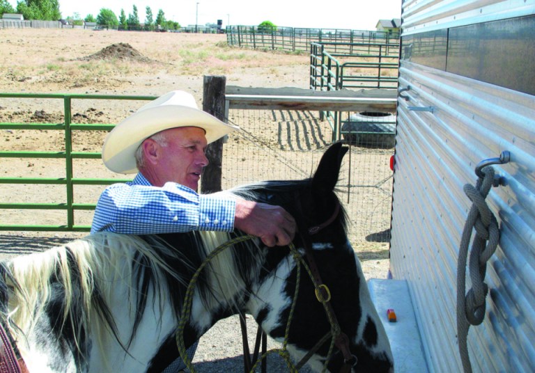 Barry Peterson removes the bridle from his horse BW at his home near Mountain Home, Idaho, Tuesday, June 19, 2012. Peterson is one of two Republicans vying to be the next chairman of the Idaho Republican Party. (AP Photo/Todd Dvorak)