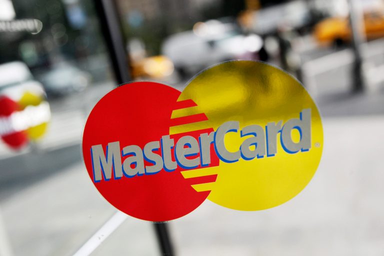 FILE  -  This Sept. 21, 2011, file photo. shows a MasterCard sign on a revolving door in New York. Mastercard Inc. reports quarterly earnings on Thursday, May 1, 2014.   (AP Photo/Mark Lennihan, File)