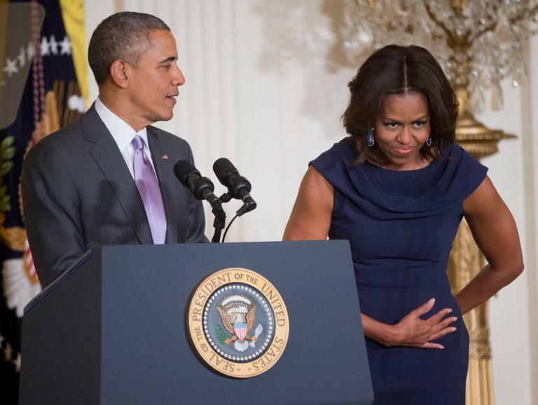 First lady Michelle Obama playfully takes a bow as she is introduced by President Barack Obama in the East Room of the White House in Washington, Tuesday, March 3, 2015, as they announce their 'Let Girls Learn' initiative. (AP Photo/Pablo Martinez Monsivais)