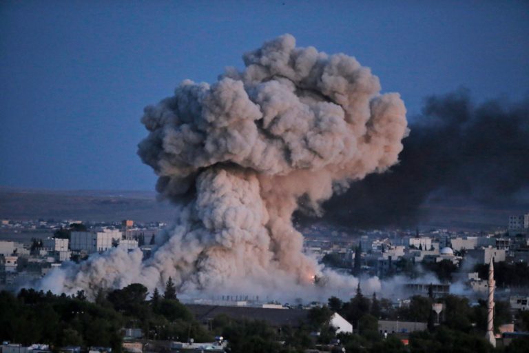 Thick smoke from an airstrike by the US-led coalition rises in Kobani, Syria, as seen from a hilltop on the outskirts of Suruc, at the Turkey-Syria border, Monday, Oct. 20, 2014 Kobani, also known as Ayn Arab, and its surrounding areas, has been under assault by extremists of the Islamic State group since mid-September and is being defended by Kurdish fighters. (AP Photo)