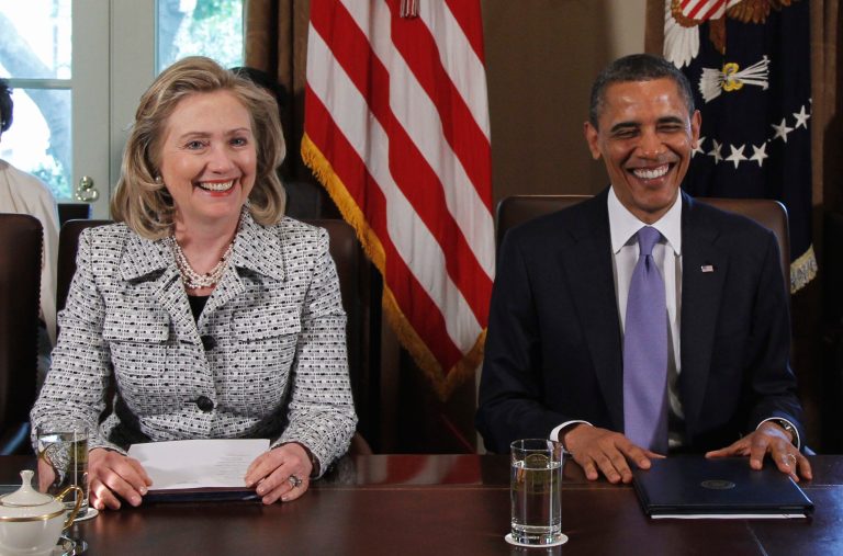 President Barack Obama smiles as he is seated with Secretary of State Hillary Rodham Clinton at the start of a Cabinet meeting at  the White House in Washington, Tuesday, May 3, 2011. (AP Photo/Charles Dharapak)