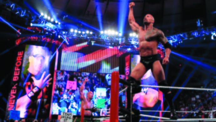 In this image released by WWE, actor and wrestler Dwayne 