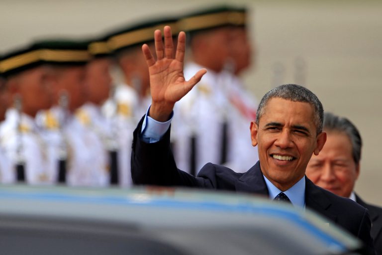 U.S. President Barack Obama waves upon his arrival for his three-day visit in Malaysia, at the Royal Malaysian Air Force base in Subang, Malaysia, Saturday, April 26, 2014. (AP Photo/Lai Seng Sin)
