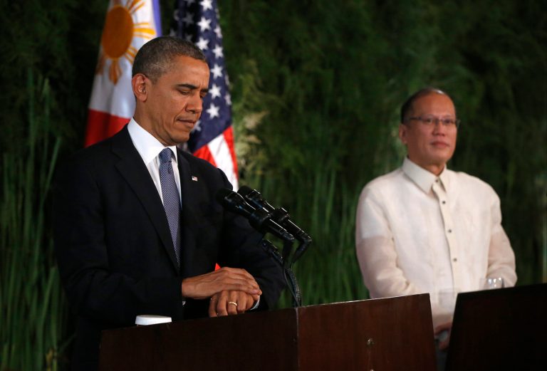 U.S. President Barack Obama looks at his watch before answering a reporter's question during a joint news conference with Philippines President Benigno Aquino III at Malacanang Palace in Manila, the Philippines, Monday, April 28, 2014. President Obama said a 10-year agreement signed Monday to give the U.S military greater access to Philippine bases will help promote regional security, improve armed forces training and shorten response times to humanitarian crises, including natural disasters. (AP Photo/Charles Dharapak)