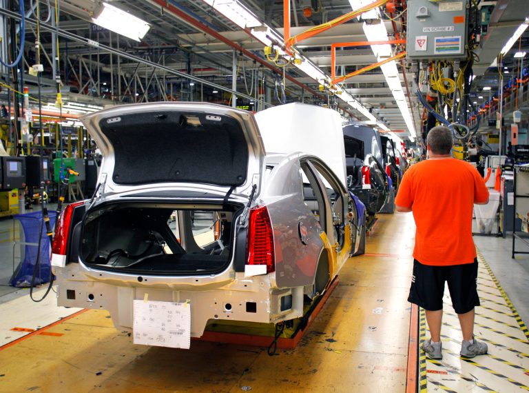 LANSING, MI, - JULY 26:  A General Motors' worker assembles a 2012 Cadillac CTS on the assembly line at the General Motors Lansing Grand River Assembly Plant July 26, 2012 in Lansing, Michigan. (Photo by Bill Pugliano/Getty Images)
