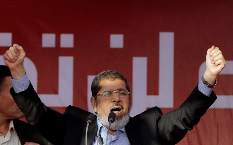 FILE - In this Friday, June 29, 2012 file photo, Egypt's President-elect Mohammed Morsi talks to his supporters at Tahrir Square, the focal point of Egyptian uprising, during his speech in Cairo, Egypt. Egyptian officials say security authorities leaked a recording of a private conversation between ousted President Mohammed Morsi and his lawyer on the sidelines of his trial, in which Morsi says protests by his supporters and the crackdown on them are 