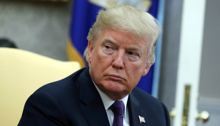 President Donald Trump listens during a meeting with Governor Ricardo Rossello of Puerto Rico in the Oval Office of the White House, Thursday, Oct. 19, 2017, in Washington. (AP Photo/Evan Vucci)