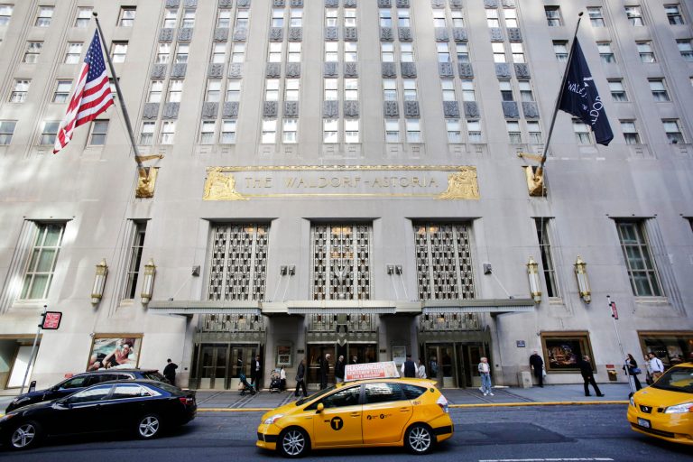 A taxi passes in front of the fabled Waldorf Astoria hotel, Monday, Oct. 6, 2014 in New York. Hilton Worldwide is selling the Waldorf Astoria New York to Chinese insurance company Anbang Insurance Group Co. for $1.95 billion. Hilton Worldwide will continue to manage the storied hotel for the next 100 years as part of an agreement with Anbang. (AP Photo/Mark Lennihan)