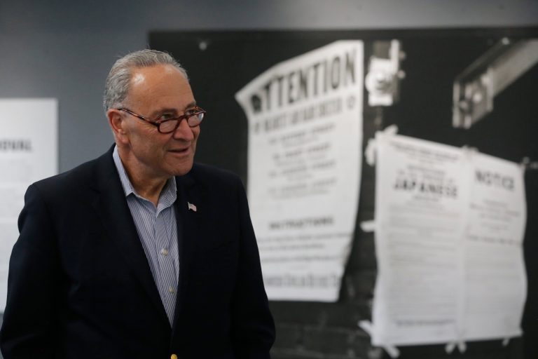 Senate Minority Leader Chuck Schumer of New York makes a brief stop at an exhibit, 