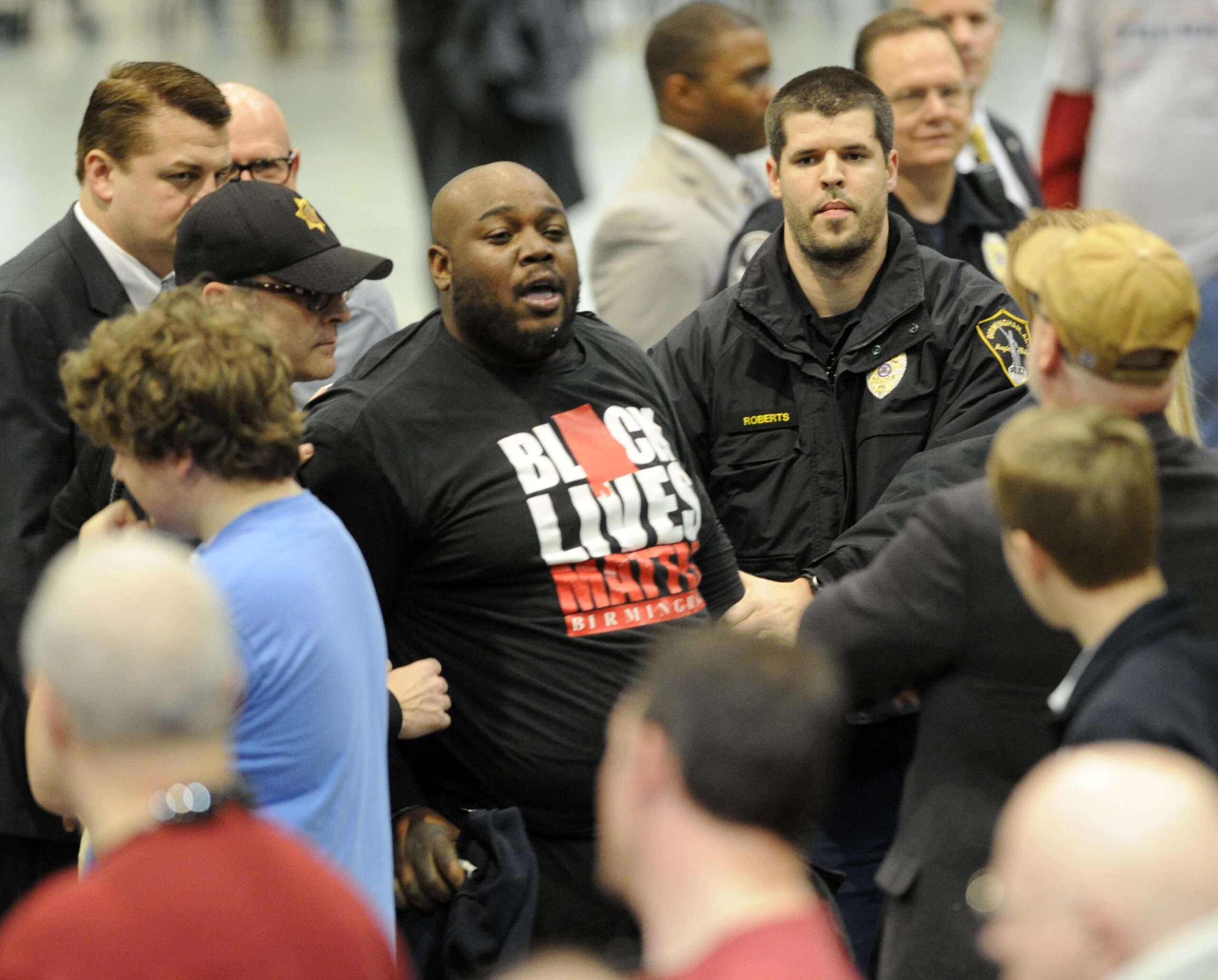Black activist beaten at Trump rally considers hate crime charges