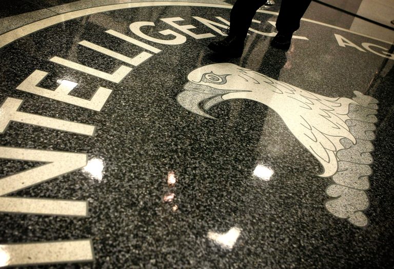 A man walks across the seal of the Central Intelligence Agency at the lobby of the Original Headquarters Building at the CIA headquarters February 19, 2009 in McLean, Va. (Photo by Alex Wong/Getty images)