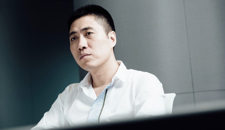 Wang Jun, founder of iCarbonX, listens during an interview in Hong Kong, China.