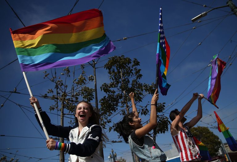 SAN FRANCISCO, CA - JUNE 26: Same-sex marriage supporters wave pride flags while celebrating the U.S Supreme Court ruling regarding same-sex marriage on June 26, 2015 in San Francisco, California. The high court ruled that same-sex couples have the right to marry in all 50 states. (Photo by Justin Sullivan/Getty Images)