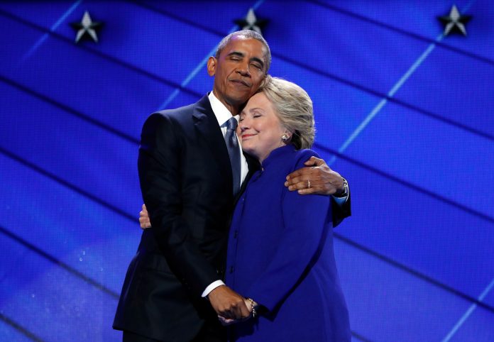 President Barack Obama hugs Democratic Presidential candidate Hillary Clinton after addressing the delegates during the third day session of the Democratic National Convention in Philadelphia, Wednesday, July 27, 2016. (AP Photo/Carolyn Kaster)