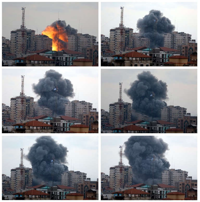 In this combination photo composed of six frames, the Al-Zafer apartment tower block collapses following Israeli airstrikes in Gaza City, in the northern Gaza Strip, Saturday, Aug. 23, 2014. Israeli aircraft fired two missiles at a 12-story apartment tower in downtown Gaza City on Saturday, collapsing the building, sending a huge fireball into the sky and wounding at least 22 people, including 11 children, witnesses and Palestinian officials said. (AP Photo/Adel Hana)