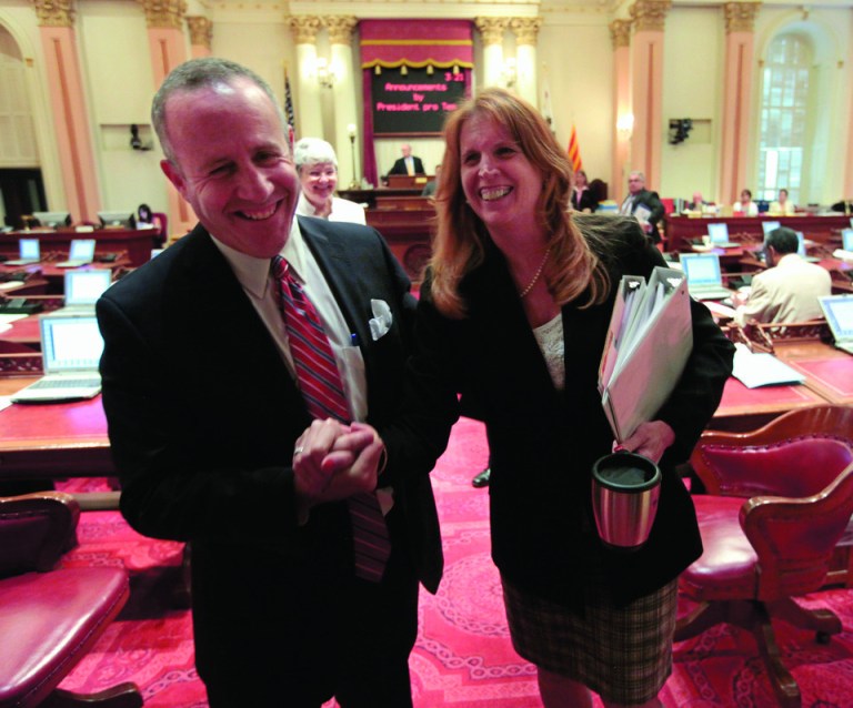 Senate President Pro Tem Darrell Steinberg, D-Sacramento, and Sen. Noreen Evans, D-Santa Rosa, smile as they leave the Senate after lawmakers approved the last of the budget-related bills at the Capitol in Sacramento, Calif. Wednesday, June 27, 2012. The Legislature approved 21 budget implementing bills to deal with a $15.7 billion budget deficit.(AP Photo/Rich Pedroncelli)