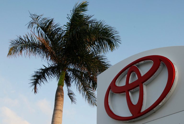 FILE - This Feb. 3, 2010 file photo shows a palm tree behind a Toyota sign at Earl Stewart Toyota in North Palm Beach, Fla. Toyota is recalling 247,000 vehicles in high-humidity areas as an air bag problem that has plagued most of the auto industry continues to widen. The recall covers vehicles in South Florida, along the Gulf Coast, in Puerto Rico, Hawaii, the U.S. Virgin Islands, Guam, Saipan and American Samoa. (AP Photo/Wilfredo Lee, File)