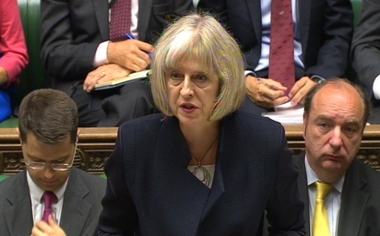 In this image taken form video Britain's Home Secretary Theresa May announces to Members of Parliament  in the House of Commons, London a review into the Home Office investigation into allegations of historical child sex abuse Monday July 7, 2014. The review will investigate whether the government and other institutions in the 1980s and 90s covered up child abuse by politicians and others in positions of power (AP Photo/PA) UNITED KINGDOM OUT NO SALES NO ARCHIVE EDITORIAL USE ONLY