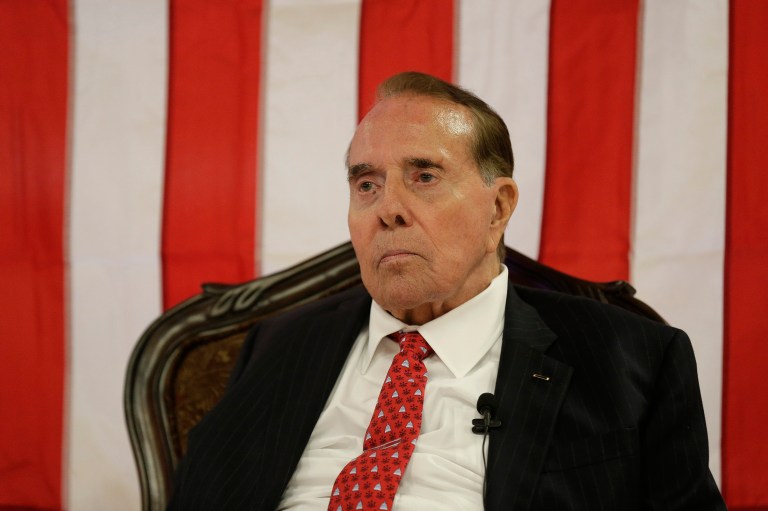 "He has criticism of Hillary, but it's sort of been scattered," said Bob Dole. (AP Photo/Charlie Riedel)