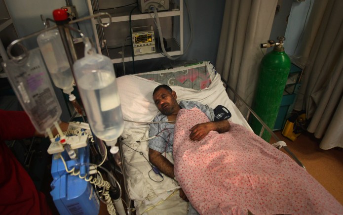 In this photo taken on Dec. 19, 2010, A wounded Afghan soldier recuperates at Dawood National Military Hospital in Kabul, Afghanistan. The top medical officer in the Afghan military has been removed after coming under investigation over deep neglect at the country's top hospital and the widespread disappearance of U.S.-donated medicines, which has left wounded and sick troops without adequate care, the Afghan defense minister says. (AP Photo/Altaf Qadri)