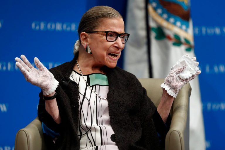 In this Sept. 20, 2017, file photo, U.S. Supreme Court Justice Ruth Bader Ginsburg reacts to applause as she is introduced by William Treanor, Dean and Executive Vice President of Georgetown University Law Center, at the Georgetown University Law Center campus in Washington. In different circumstances, Ginsburg might be on a valedictory tour in her final months on the Supreme Court. But in the era of Donald Trump, the 84-year-old Ginsburg is packing her schedule and sending signals she intends to keep her seat on the bench for years.(AP Photo/Carolyn Kaster, File)