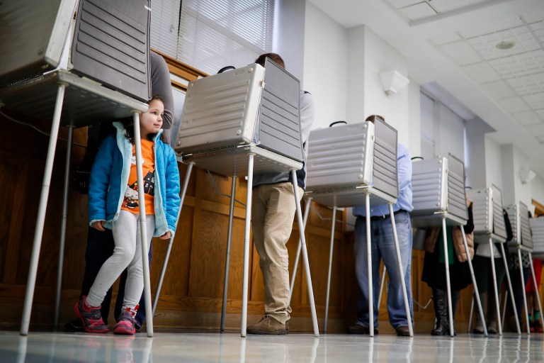 According to the exit poll, whites voted 58 to 37 percent for Trump over Clinton. (AP Photo/John Minchillo)