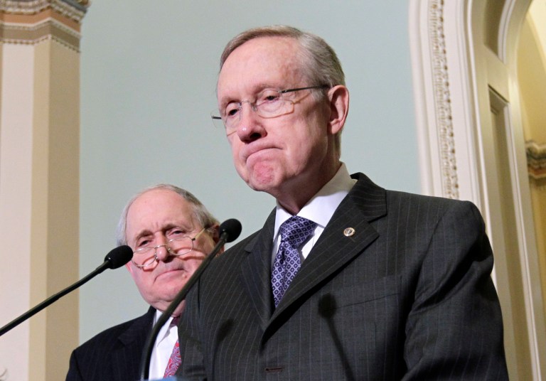 Senate Majority Leader Harry Reid of Nevada, right, accompanied by Sen. Carl Levin, D-Mich., talks to reporters on Capitol Hill in Washington, Monday, May 2, 2011. (AP Photo/J. Scott Applewhite)