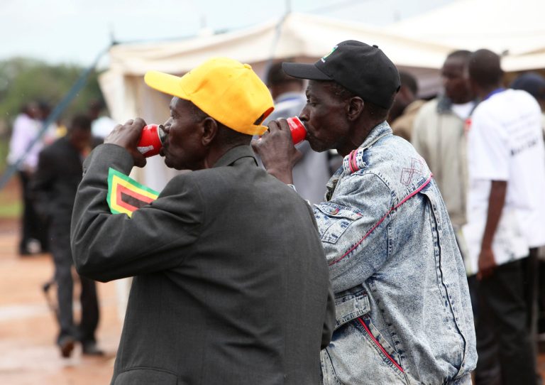   CORRECTION ADDS MEMBERS TO FIRST SENTENCE Zanu PF members, during a break on the closing day of the 13th annual conference, in Gweru about 250 Kilometres South west of the capital Harare, in Zimbabwe, Saturday, Dec, 8, 2012. Zimbabwean President Robert Mugabe is set to officially close the conference, his last as a President of the current government, ahead of elections set for next year. (AP Photo/Tsvangirayi Mukwazhi)  