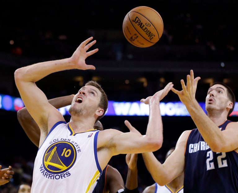   Golden State Warriors' David Lee (10) looks for a rebound next to Charlotte Bobcats' Byron Mullens (22) during the first half of an NBA basketball game in Oakland, Calif., Friday, Dec. 21, 2012. (AP Photo/Marcio Jose Sanchez)  