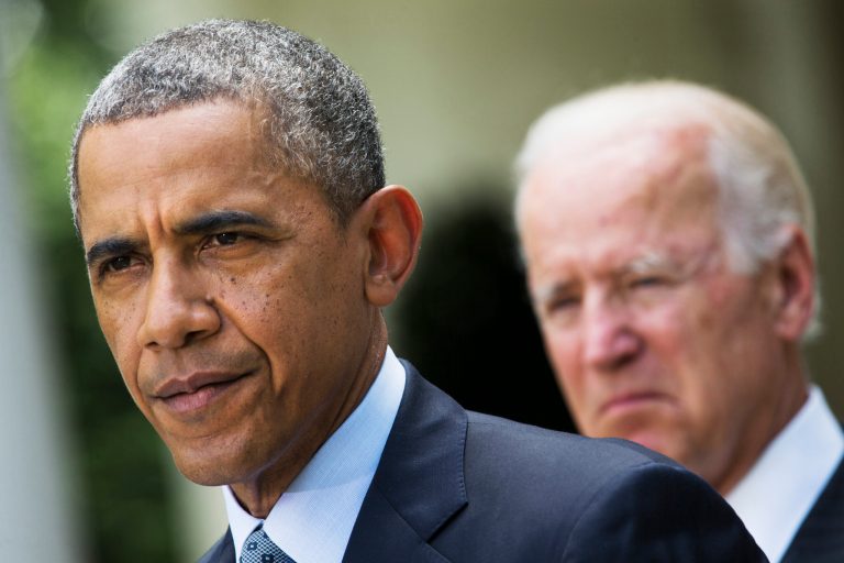 FILE - In this June 30, 2014, file photo, President Barack Obama, accompanied by Vice President Joe Biden, pauses while making a statement about immigration reform, in the Rose Garden of the White House in Washington. Obama over time has been embraced and scorned by immigrant advocates who have viewed him as both a champion and an obstacle to their cause. (AP Photo/Jacquelyn Martin, File)