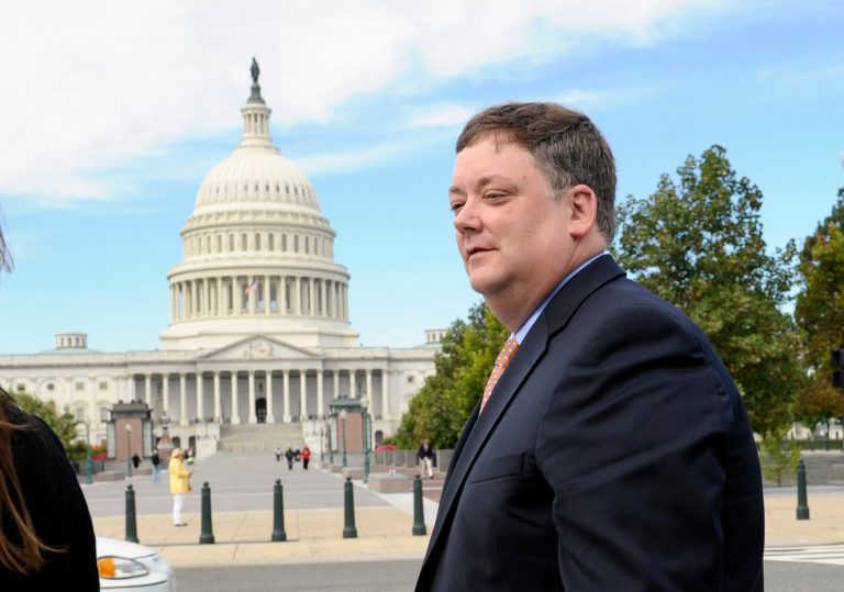 Republican activist Shaun McCutcheon walks past the Capitol as he leaves the Supreme Court in Washington on Oct. 8. (AP Photo/Susan Walsh)