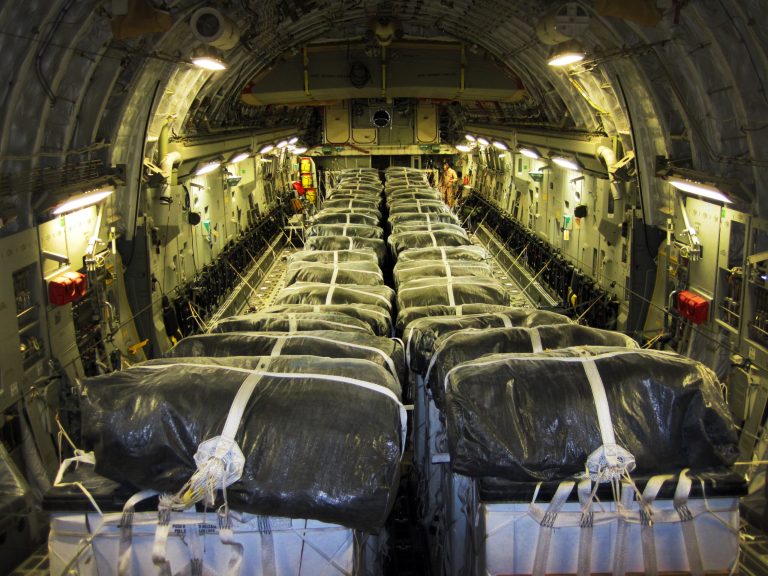 This image provided by the U.S. Defense Department shows pallets of bottled water are loaded aboard a U.S. Air Force C-17 Globemaster III aircraft in preparation for a humanitarian airdrop over Iraq Aug. 8, 2014. Airmen with the 816th Expeditionary Airlift Squadron airdropped 40 bundles of water for displaced citizens in the vicinity of Sinjar, Iraq. American planes conducted a second airdrop of food and water early Saturday for those trapped in the Sinjar mountains, said Pentagon chief spokesman Rear Adm. John Kirby. (AP Photo/U.S. Air Force, Staff Sgt. Vernon Young Jr.)
