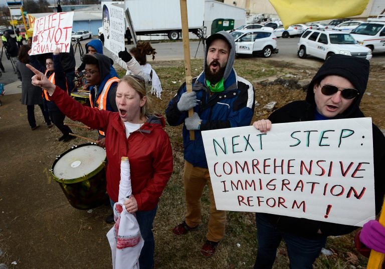 Demonstrators near the Casa Azafran community center in Nashville, Tenn., Tuesday, Dec. 9, 2014, after PresidentObama arrived to speak about immigration reform. (AP Photo/Mark Zaleski)