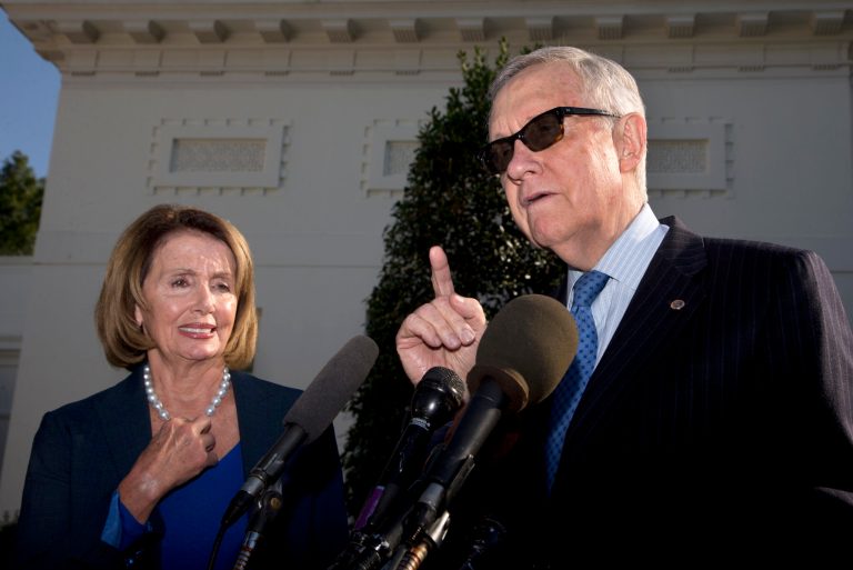 Senate Minority Leader Harry Reid of Nev., accompanied by House Minority Leader Nancy Pelosi of Calif. (AP Photo/Manuel Balce Ceneta)