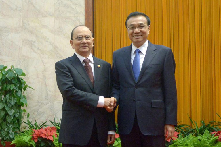 Chinese Premier Li Keqiang, right, and Myanmar President Thein Sein pose for the photo before their meeting at the Great Hall of the People in Beijing, Saturday, June 28,2014.  (AP Photo/Wang Zhao, Pool)