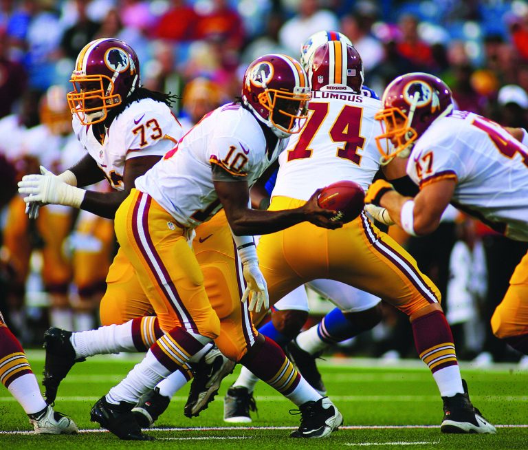 Rick Stewart/Getty Images
Washington Redskins rookie quarterback Robert Griffin III, left, threw for 70 yards and a touchdown in his preseason debut.