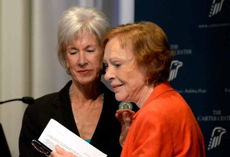 Former First Lady Rosalynn Carter, right, thanks Department of Health and Human Services Secretary Kathleen Sebelius,  after Sebelius announced easier access to mental health care during the 29th annual mental health policy symposium at the Carter Center on Friday, Nov. 8, 2013, in Atlanta. (AP Photo/David Tulis)